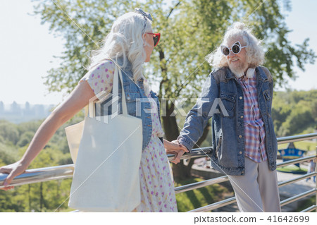 Nice aged people standing on the bridge Nice aged people standing on the bridge 41642699