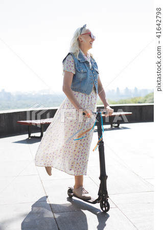 Happy cheerful woman having a wonderful time Happy cheerful woman having a wonderful time 41642798