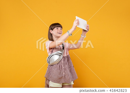 Gleeful girl holding her modern tablet Gleeful girl holding her modern tablet 41642823