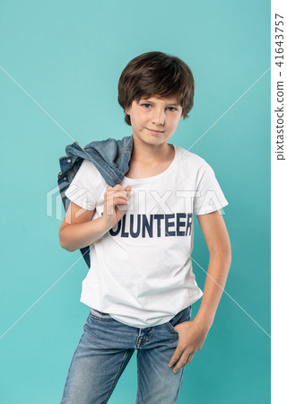 Happy young volunteer holding his jacket 41643757