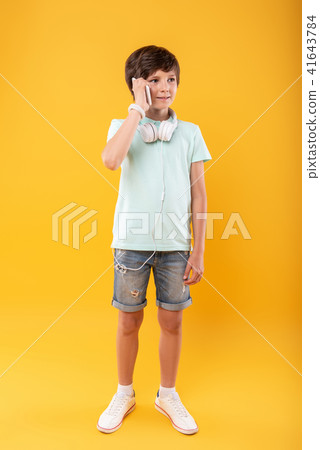 Cheerful child talking on the phone 41643784