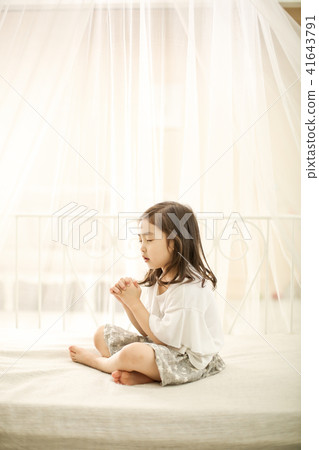 A girl praying A girl praying 41643791