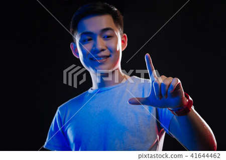 Selective focus of a male finger 41644462