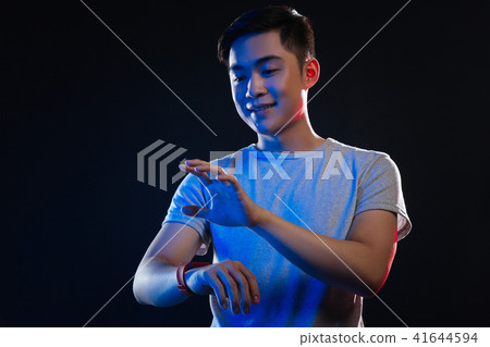 Happy cheerful man having a smartwatch 41644594