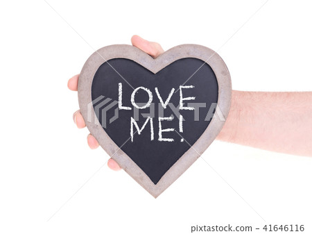 Adult holding heart shaped chalkboard 41646116