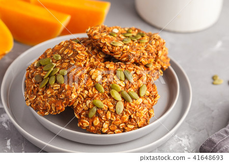 Fresh oatmeal pumpkin cookies on a gray plate 41648693