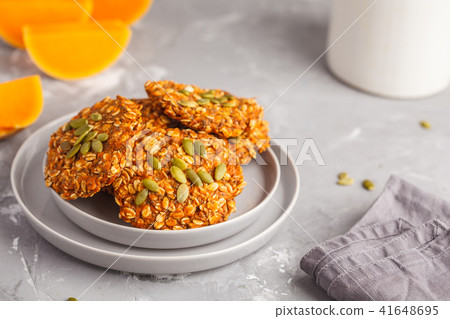 Fresh oatmeal pumpkin cookies on a gray plate 41648695