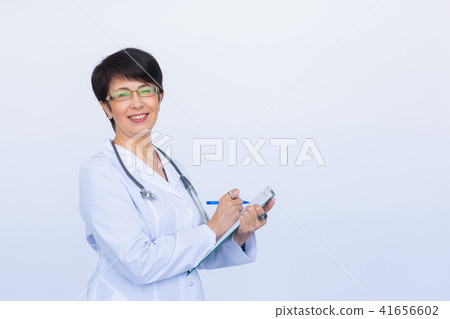 Medical physician doctor woman over white background with copy space 41656602