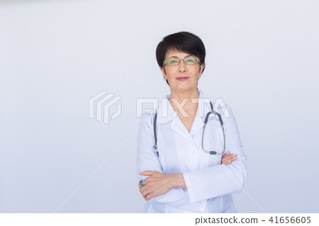 Portrait of doctor woman with stethoscope over white background Portrait of doctor woman with stethoscope over white background 41656605