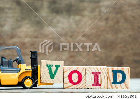 Yellow forklift hold letter block V to word void Yellow forklift hold letter block V to word void 41656801