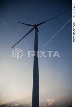 Wind turbine farm of silhouette at sunset. 41657370