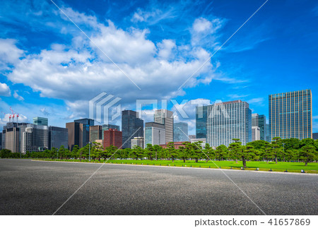 Modern building with green Zen garden on blue sky Modern building with green Zen garden on blue sky 41657869