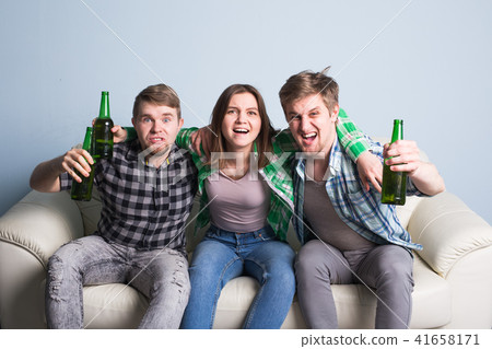 Happy friends or football fans watching soccer on tv and celebrating victory. Friendship, sports and 41658171