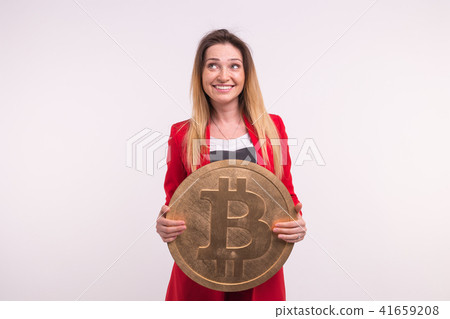 Studio portrait of young business woman with bitcoin. Studio portrait of young business woman with bitcoin. 41659208