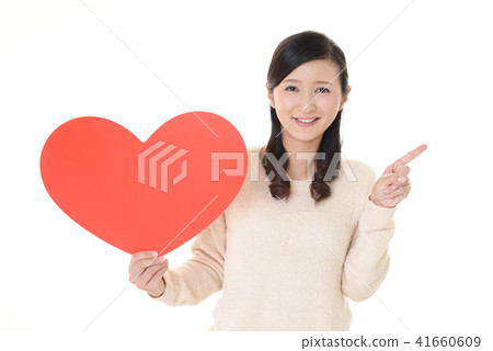 A smiling woman with a heart mark 41660609