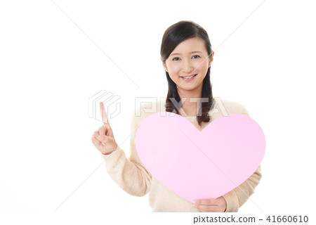 A smiling woman with a heart mark A smiling woman with a heart mark 41660610
