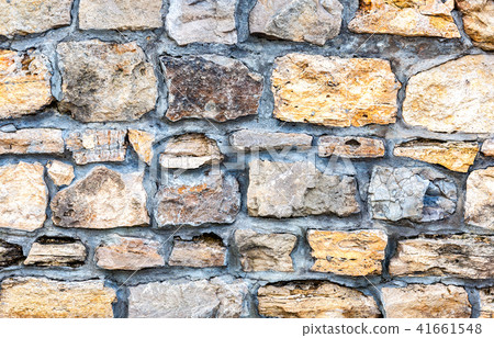 Weathered stone wall as creative background 41661548