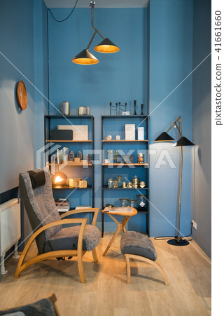 Apartment with modern armchairs and blue wall 41661660