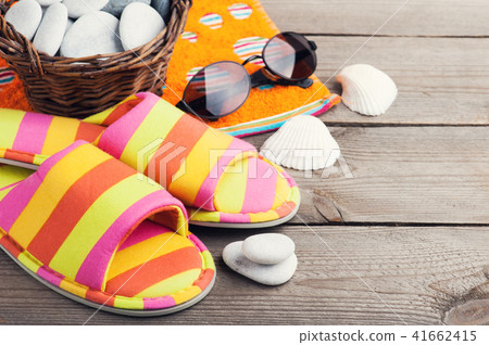 Striped flip flops, shells, sunglasses 41662415