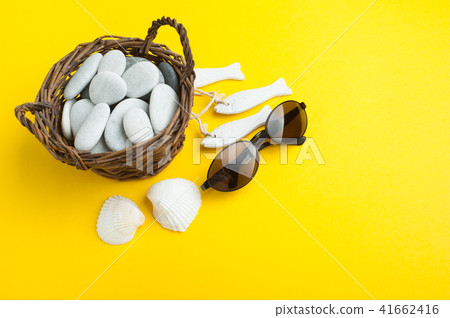 Shells, sunglasses and pebbles 41662416