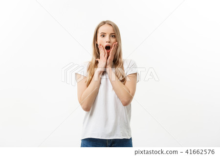 Lifestyle Concept: Portrait of happy blond surprised young woman on white background. 41662576
