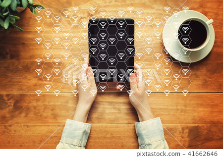 WiFi concept with a person holding a tablet 41662646