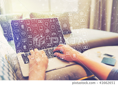 E-Learning concept with person using laptop computer 41662651