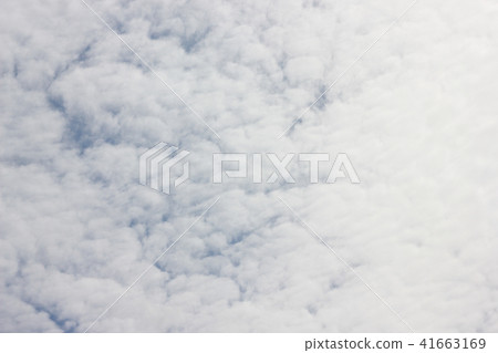 White cirrocumulus clouds on blue sky 41663169