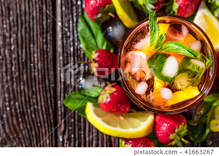 Homemade srawberry mojito and berries on wood 41663267