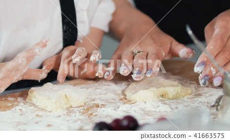 Female hands forms homemade pancakes from cottage cheese 41663575