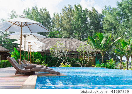 Swimming pool and bar by a beach 41667859