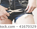 Sexy girl in denim handmade shorts. 41670329