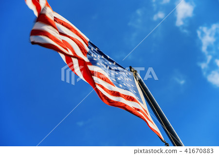 Star-striped American flag flutters  41670883