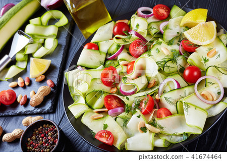 savory zucchini ribbon salad, top view savory zucchini ribbon salad, top view 41674464