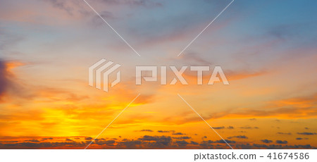 Cloudy sky and bright sun rise over the horizon. Cloudy sky and bright sun rise over the horizon. 41674586