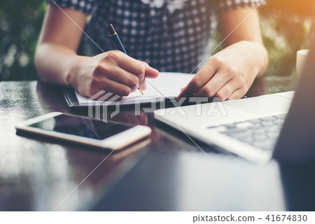Close-up of young beautiful woman hands writing Close-up of young beautiful woman hands writing 41674830