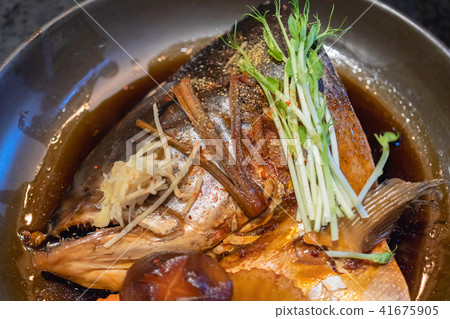 salmon fish head soup with soy sauce salmon fish head soup with soy sauce 41675905