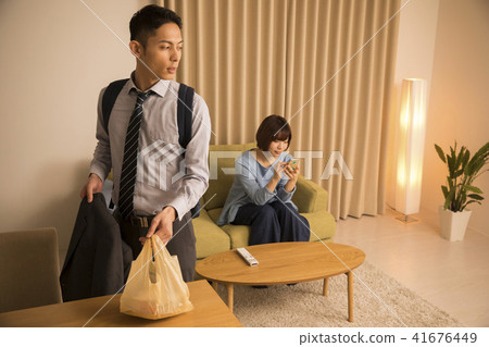 A wife ignoring a late return home husband A wife ignoring a late return home husband 41676449