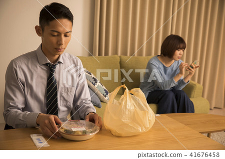 A wife ignoring a late return home husband 41676458