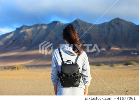 Back view of traveler woman Back view of traveler woman 41677061
