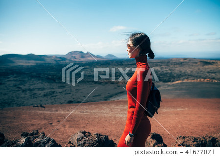 woman enjoy unique volcanic landscapes 41677071