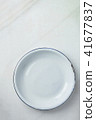 White Vintage Enamel Plate on Marble Stone  41677837