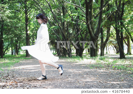 Walking stroll Beauty Lifestyle Portrait Woman fresh green Walking stroll Beauty Lifestyle Portrait Woman fresh green 41678440