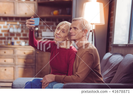 Mature loving couple posing on camera Mature loving couple posing on camera 41678871