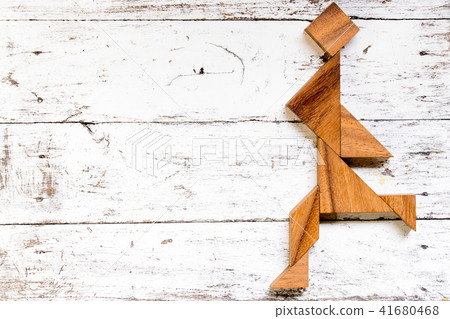 Tangram puzzle in happy running man shape 41680468