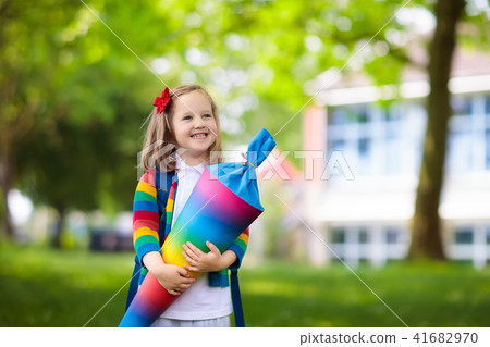 Little child with candy cone on first school day 41682970
