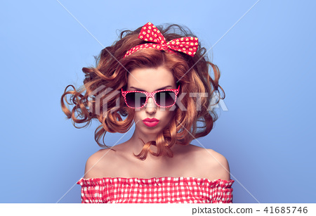 Pinup Beauty Girl Blowing Lips Curly Hairstyle Stock Photo