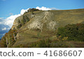 High mountain with a cliff and blue sky with cloud 41686607