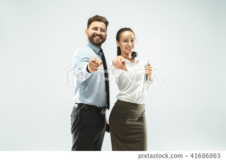 a business man shows the laptop to his colleague in the office. a business man shows the laptop to his colleague in the office. 41686863