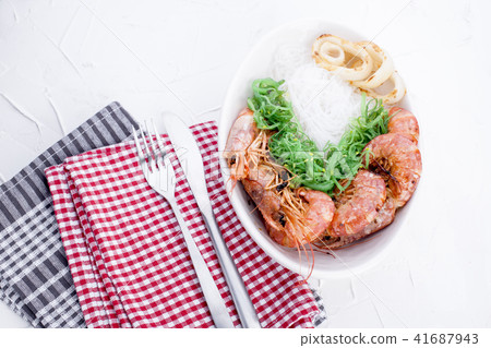 Rice noodles and shrimp are large, oriental cuisine, healthy lunch. Copy space. Rice noodles and shrimp are large, oriental cuisine, healthy lunch. Copy space. 41687943